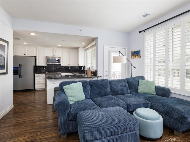 5447 Marine Ave Unit 7, Lawndale, CA 90260 - living room with dark wood-style floors, visible vents, and recessed lighting