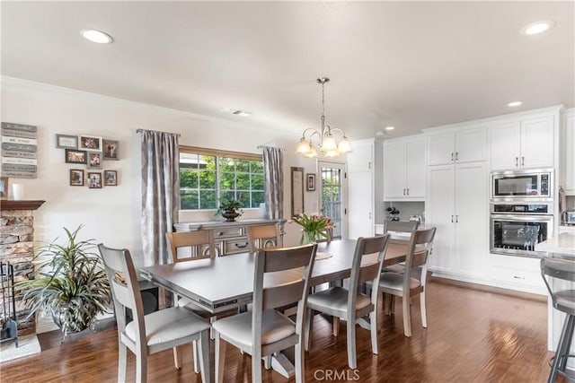 dining area featuring an inviting chandelier, dark wood-type flooring, visible vents, and recessed lighting