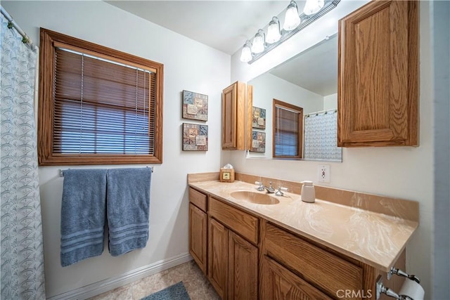 bathroom featuring vanity and baseboards