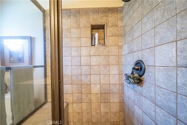 bathroom with tiled shower