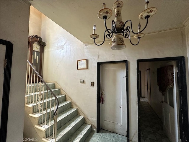 606 W 57th St, Los Angeles, CA 90037 - stairs with tile patterned floors and a chandelier