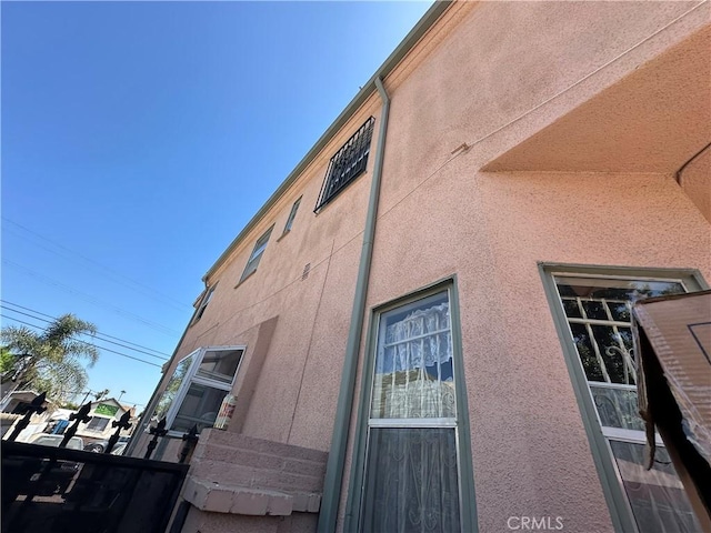 606 W 57th St, Los Angeles, CA 90037 - view of side of property with stucco siding