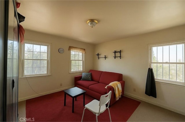 606 W 57th St, Los Angeles, CA 90037 - living room featuring carpet flooring and baseboards
