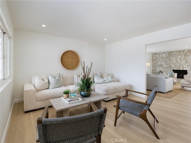5244 W 137th Pl, Hawthorne, CA 90250 - living area featuring light wood-type flooring, baseboards, a stone fireplace, and recessed lighting