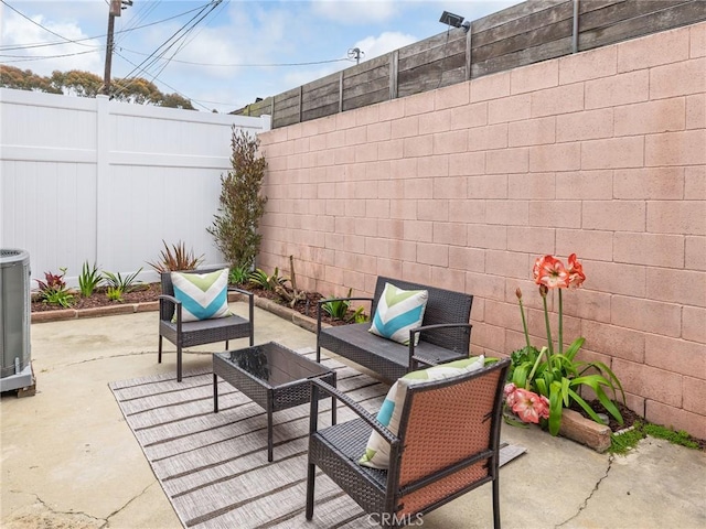 5244 W 137th Pl, Hawthorne, CA 90250 - view of patio / terrace featuring an outdoor living space, cooling unit, and a fenced backyard