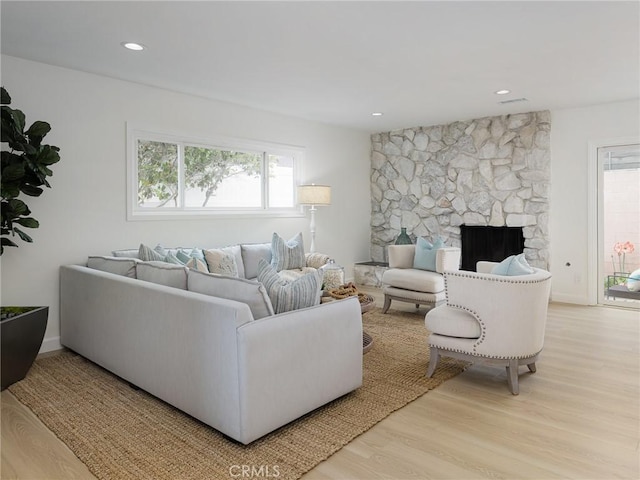 5244 W 137th Pl, Hawthorne, CA 90250 - living room featuring recessed lighting, a stone fireplace, and wood finished floors
