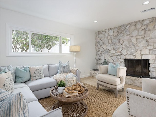 5244 W 137th Pl, Hawthorne, CA 90250 - living room with recessed lighting, baseboards, a stone fireplace, visible vents, and wood finished floors