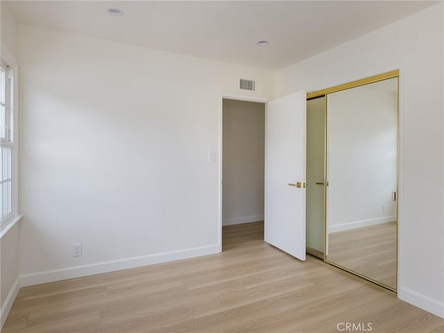 5244 W 137th Pl, Hawthorne, CA 90250 - unfurnished bedroom with baseboards, a closet, light wood-style flooring, and visible vents