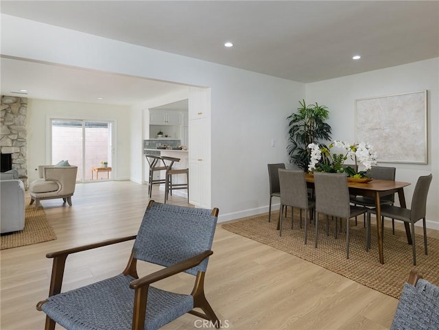 5244 W 137th Pl, Hawthorne, CA 90250 - dining space with light wood finished floors, baseboards, a stone fireplace, and recessed lighting