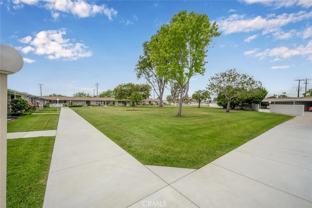 surrounding community featuring a yard