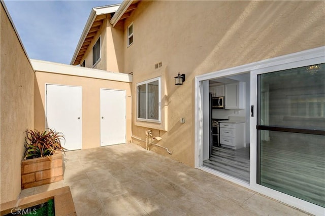 3500 W Manchester Blvd Unit 15, Inglewood, CA 90305 - doorway to property featuring stucco siding, visible vents, and a patio