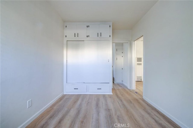 3731 Glendon Ave, Los Angeles, CA 90034 - unfurnished bedroom with light wood-style flooring and baseboards