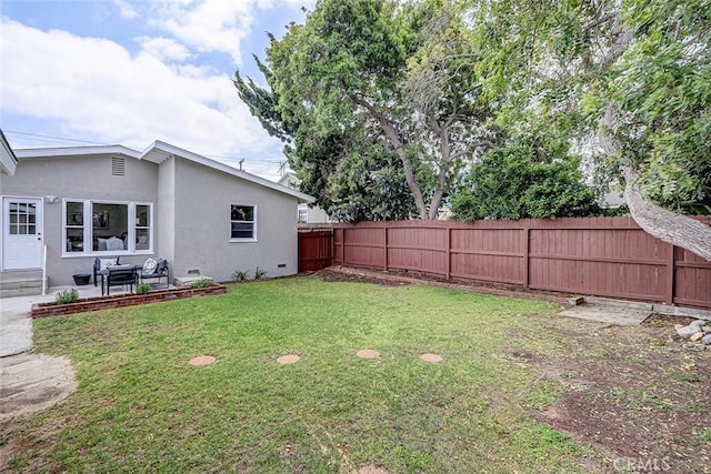 view of yard with a fenced backyard