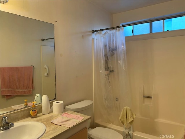 full bathroom with toilet, vanity, and shower / bathtub combination with curtain