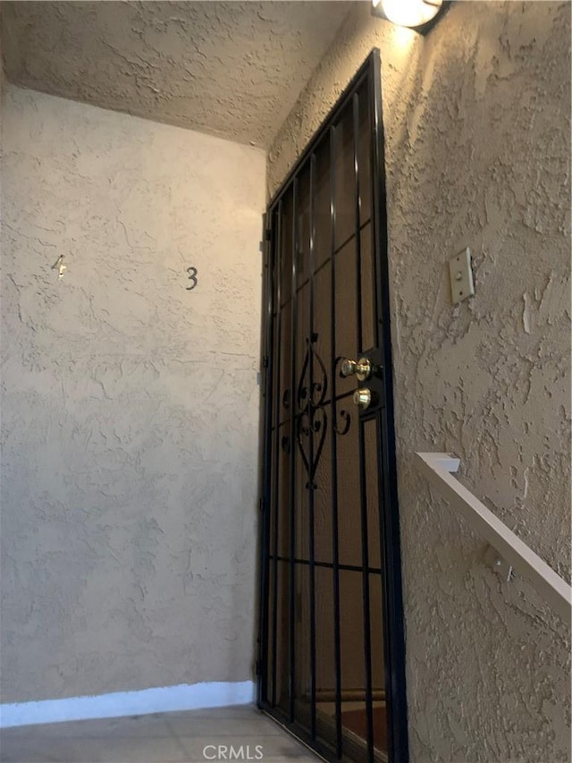 view of exterior entry with stucco siding