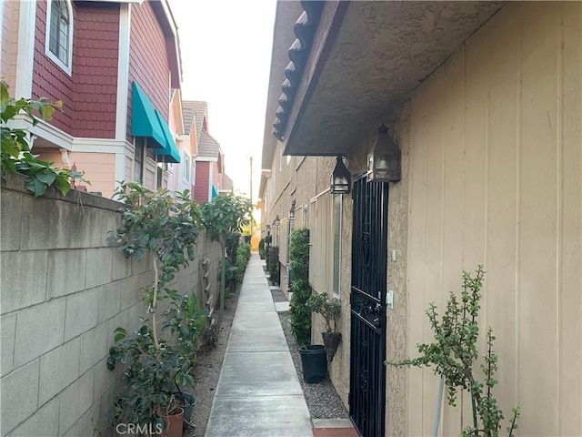 view of side of home with fence