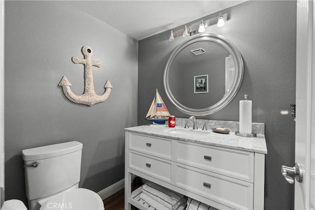 30151 Via Amante, Menifee, CA 92584 - bathroom featuring vanity, toilet, and baseboards