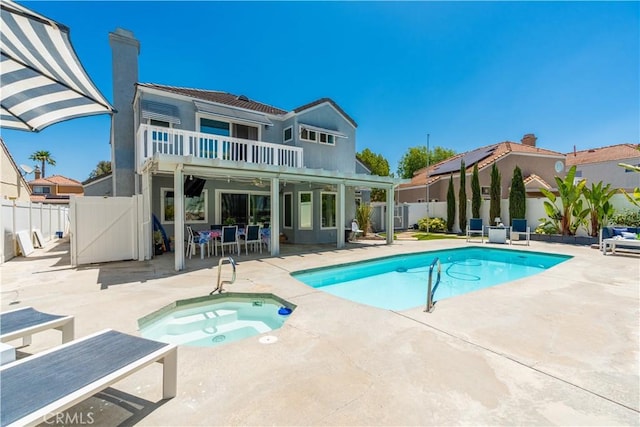 30151 Via Amante, Menifee, CA 92584 - rear view of property featuring an in-ground hot tub, a patio area, a balcony, a fenced backyard, and a gate