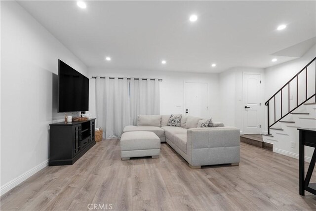 17730 Regency Cir, Bellflower, CA 90706 - living area featuring light wood-style flooring, baseboards, and recessed lighting