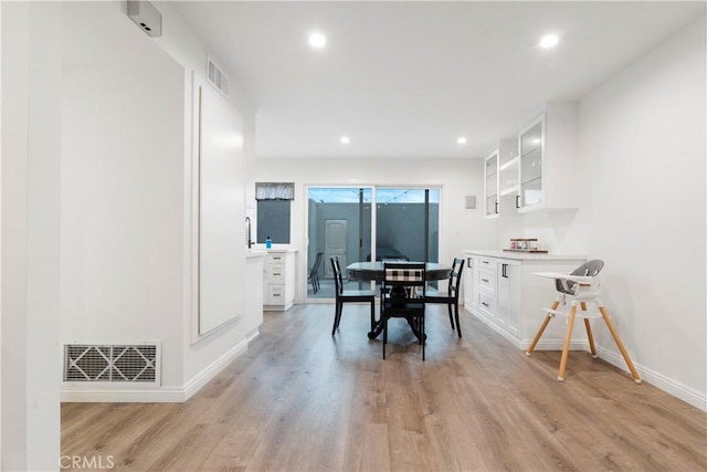 17730 Regency Cir, Bellflower, CA 90706 - dining area featuring baseboards, recessed lighting, light wood-style flooring, and visible vents