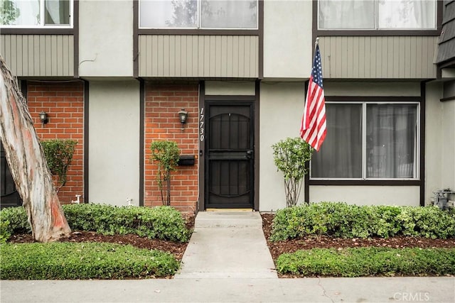 17730 Regency Cir, Bellflower, CA 90706 - property entrance featuring brick siding and stucco siding