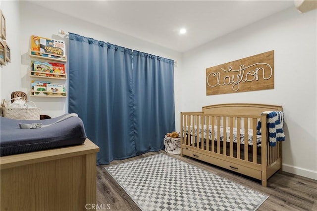 17730 Regency Cir, Bellflower, CA 90706 - bedroom with a nursery area, wood finished floors, and recessed lighting