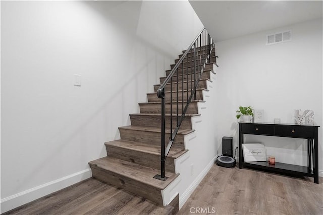 17730 Regency Cir, Bellflower, CA 90706 - staircase featuring baseboards, visible vents, and wood finished floors