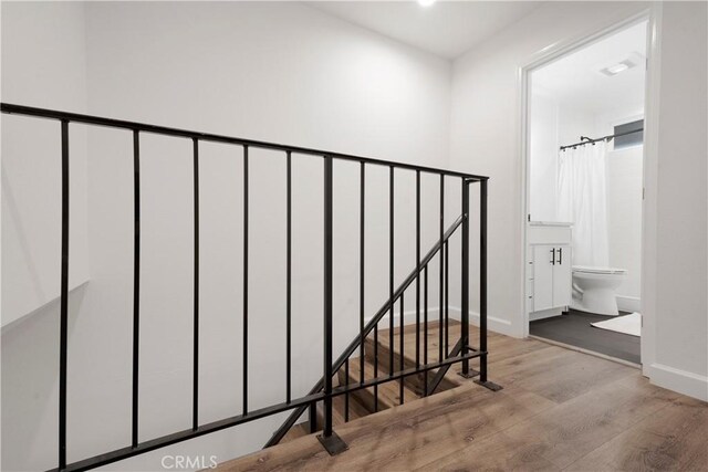 17730 Regency Cir, Bellflower, CA 90706 - stairs featuring baseboards and wood finished floors