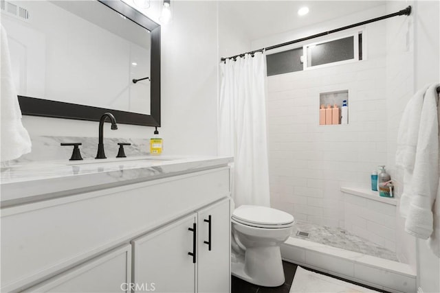 17730 Regency Cir, Bellflower, CA 90706 - full bathroom featuring toilet, tiled shower, vanity, and visible vents