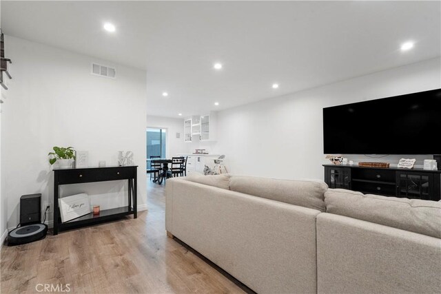 17730 Regency Cir, Bellflower, CA 90706 - living area featuring visible vents, wood finished floors, and recessed lighting