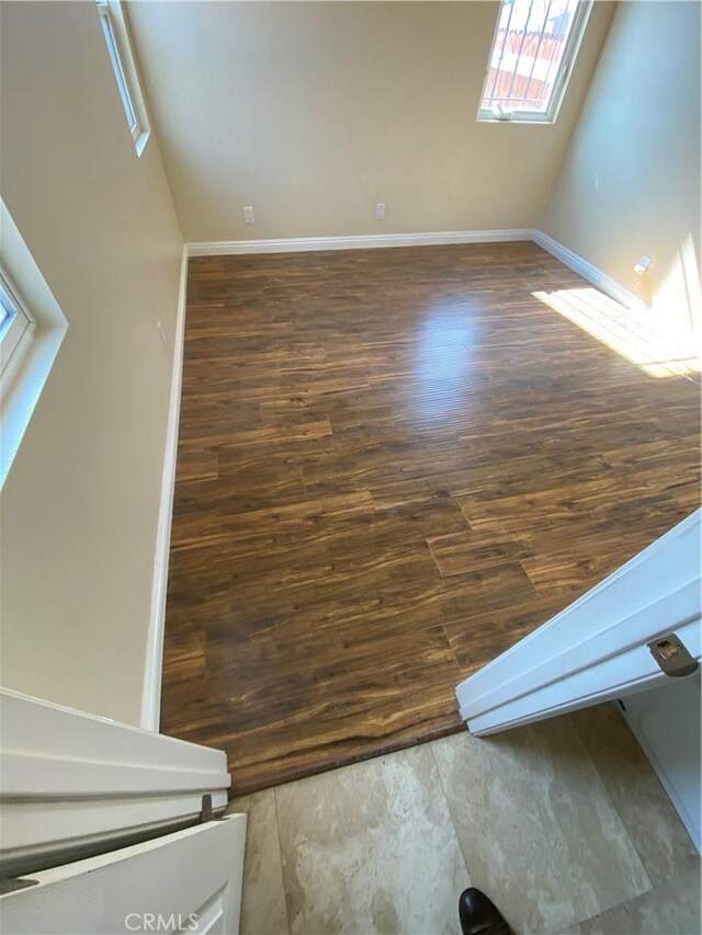 5507 S Manhattan Pl, Los Angeles, CA 90062 - bonus room with a wealth of natural light, wood finished floors, and baseboards