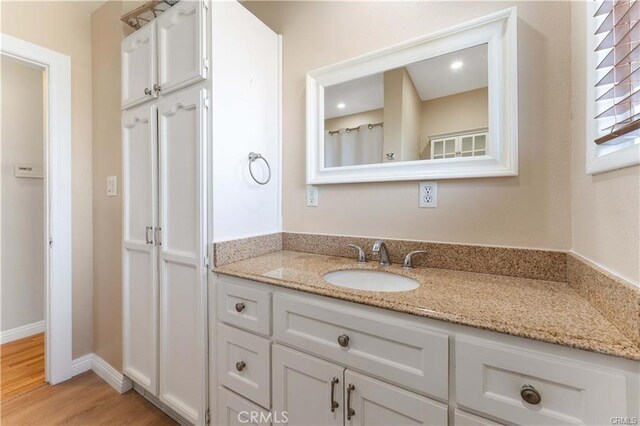 2517 E Walnut Crk, West Covina, CA 91791 - full bathroom featuring vanity and wood finished floors