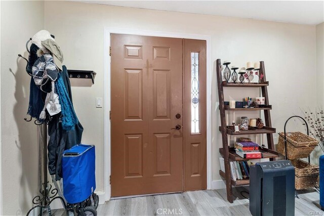 2517 E Walnut Crk, West Covina, CA 91791 - entrance foyer with light wood-style floors and baseboards