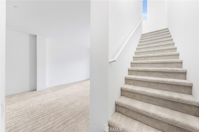 staircase with carpet