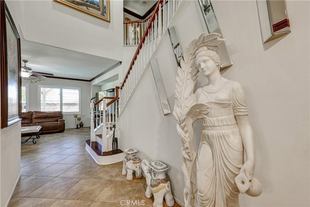 31710 Waterfall Way, Murrieta, CA 92563 - stairs with tile patterned floors, baseboards, a ceiling fan, and ornamental molding
