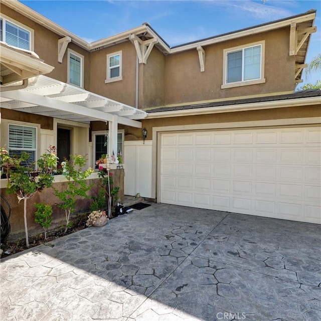 31710 Waterfall Way, Murrieta, CA 92563 - view of front of property with an attached garage, stucco siding, driveway, and a pergola