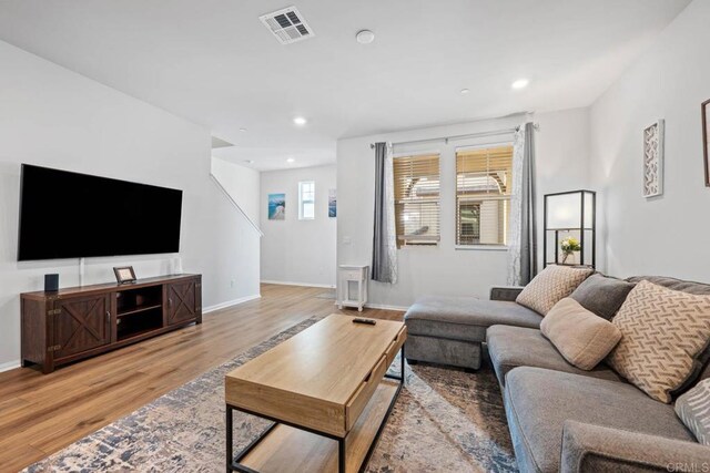 40603 Melrose Dr, Temecula, CA 92591 - living area with light wood-type flooring, visible vents, baseboards, and recessed lighting