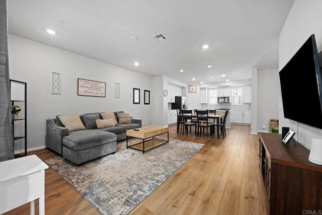 40603 Melrose Dr, Temecula, CA 92591 - living room with recessed lighting, visible vents, and light wood-style floors