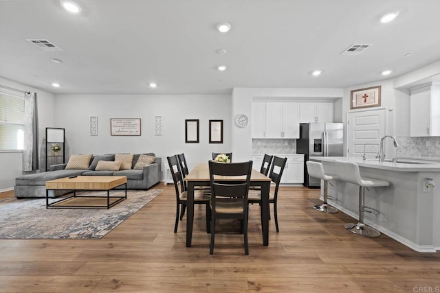 40603 Melrose Dr, Temecula, CA 92591 - dining room with visible vents, wood finished floors, and recessed lighting