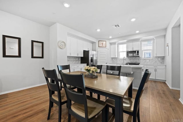 40603 Melrose Dr, Temecula, CA 92591 - dining space featuring recessed lighting, baseboards, visible vents, and wood finished floors
