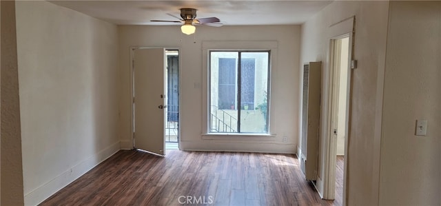 954 N Van Ness Ave, Los Angeles, CA 90038 - empty room with baseboards, a heating unit, ceiling fan, and dark wood-type flooring