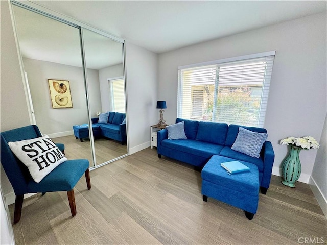 9556 Bloomfield St, Cypress, CA 90630 - living room featuring light wood finished floors, plenty of natural light, and baseboards