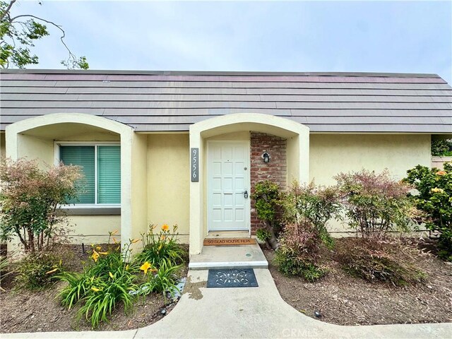9556 Bloomfield St, Cypress, CA 90630 - entrance to property featuring stucco siding