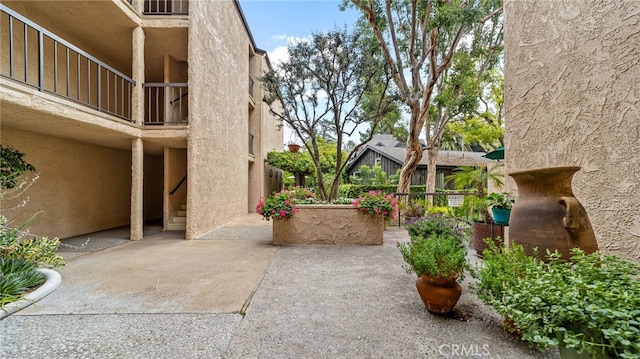 view of home's community featuring a patio area