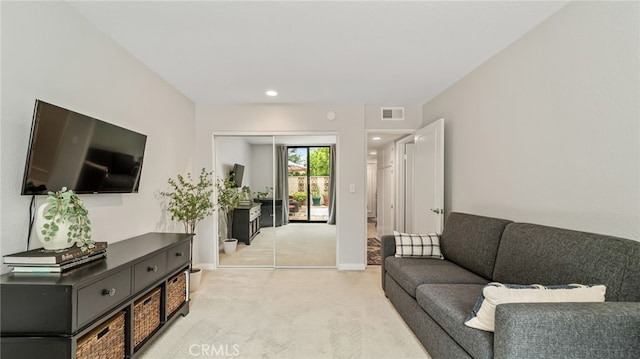 living area with light colored carpet, baseboards, and recessed lighting