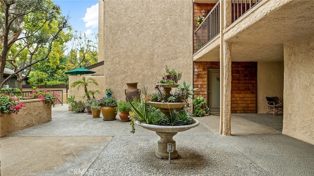 view of yard with a patio and a balcony