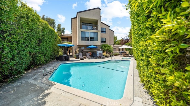 community pool with a patio