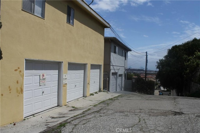 2302 S Gaffey St Unit 1, San Pedro, CA 90731 - view of side of property with stucco siding and a garage