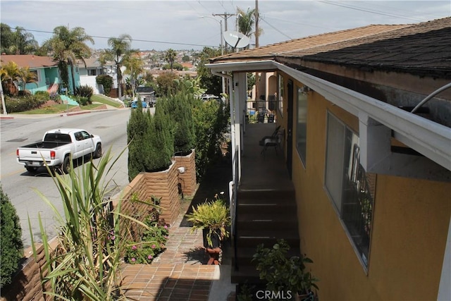 view of property exterior featuring roof with shingles