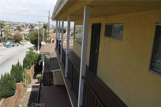 view of side of home featuring stucco siding and a residential view